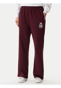 TOMMY HILFIGER - Tommy Hilfiger Spodnie dresowe UW0UW06081 Bordowy Wide Leg. Kolor: czerwony. Materiał: bawełna