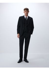 Reserved - Spodnie garniturowe z wełną - czarny. Kolor: czarny. Materiał: wełna #1
