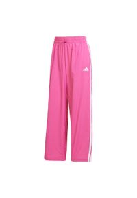 Adidas - Spodnie Essentials 3-Stripes Lifestyle Woven Parachute. Kolor: biały, wielokolorowy, różowy. Materiał: materiał