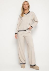 Born2be - Jasnobeżowy Dzianinowy Komplet z Ozdobną Lamówką Sweter i Szerokie Spodnie Ralenae. Kolor: beżowy. Materiał: dzianina
