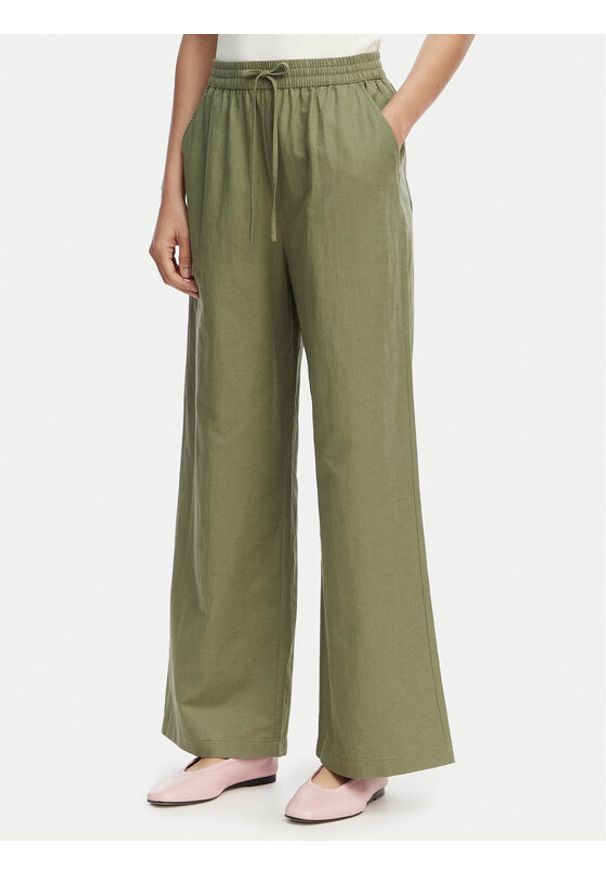 Tommy Jeans Spodnie materiałowe DW0DW22285 Zielony Loose Fit. Kolor: zielony. Materiał: len
