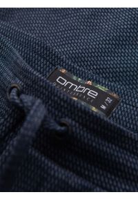 Ombre Clothing - Męskie krótkie spodenki na gumce ze strukturalnej dzianiny – granatowe V1. Okazja: na co dzień. Kolor: niebieski. Materiał: dzianina. Długość: krótkie. Styl: klasyczny, casual