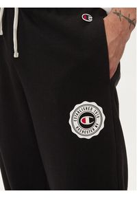 Champion Spodnie dresowe 219849 Czarny Custom Fit. Kolor: czarny. Materiał: syntetyk, bawełna