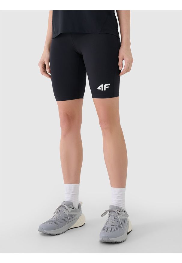 4f - 4F Legginsy kolarki treningowe damskie - czarne M. Kolor: czarny. Materiał: dzianina, włókno, syntetyk, materiał, elastan. Wzór: gładki, ze splotem, jednolity. Sport: fitness
