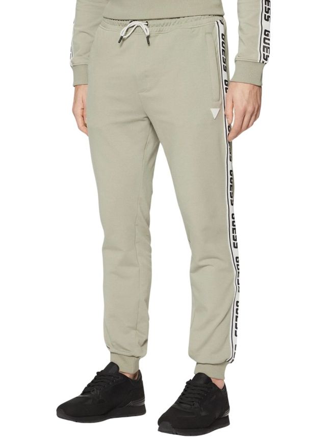 Guess - GUESS Zielone męskie spodnie dresowe z lampasami New Arlo, Rozmiar XL. Kolor: zielony. Materiał: dresówka