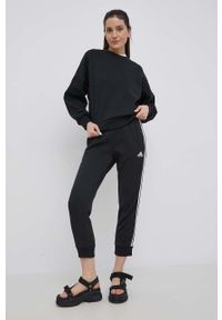 Adidas - adidas spodnie damskie kolor czarny z aplikacją. Stan: podwyższony. Kolor: czarny. Materiał: materiał, bawełna, dzianina. Wzór: aplikacja