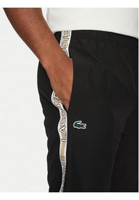 Lacoste Spodnie dresowe XH8974 Czarny Relaxed Fit. Kolor: czarny. Materiał: syntetyk