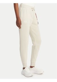 Under Armour Spodnie dresowe UA Icon Fleece 6001537 Beżowy Slim Fit. Kolor: beżowy. Materiał: bawełna #1