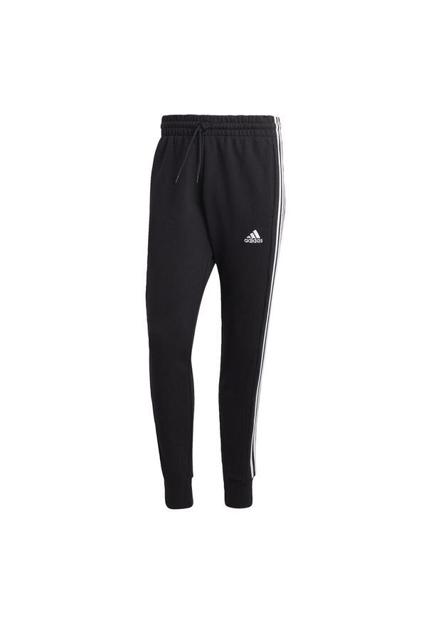 Adidas - Essentials French Terry Tapered Cuff 3-Stripes Pants. Kolor: biały, wielokolorowy, czarny. Materiał: dresówka