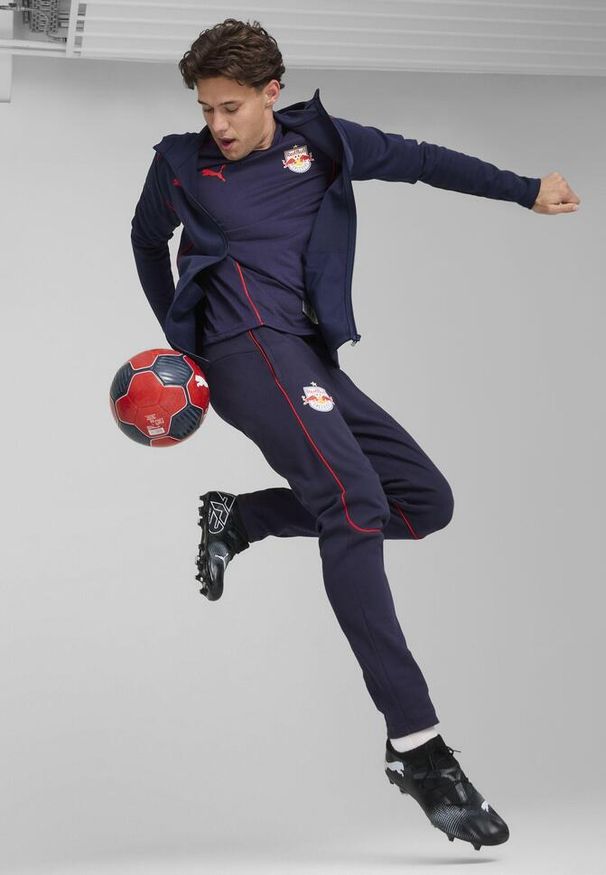 Puma - Męska kurtka z kapturem Casuals FC Red Bull Salzburg PUMA Navy Red Blue. Typ kołnierza: kaptur. Kolor: czerwony, wielokolorowy, niebieski