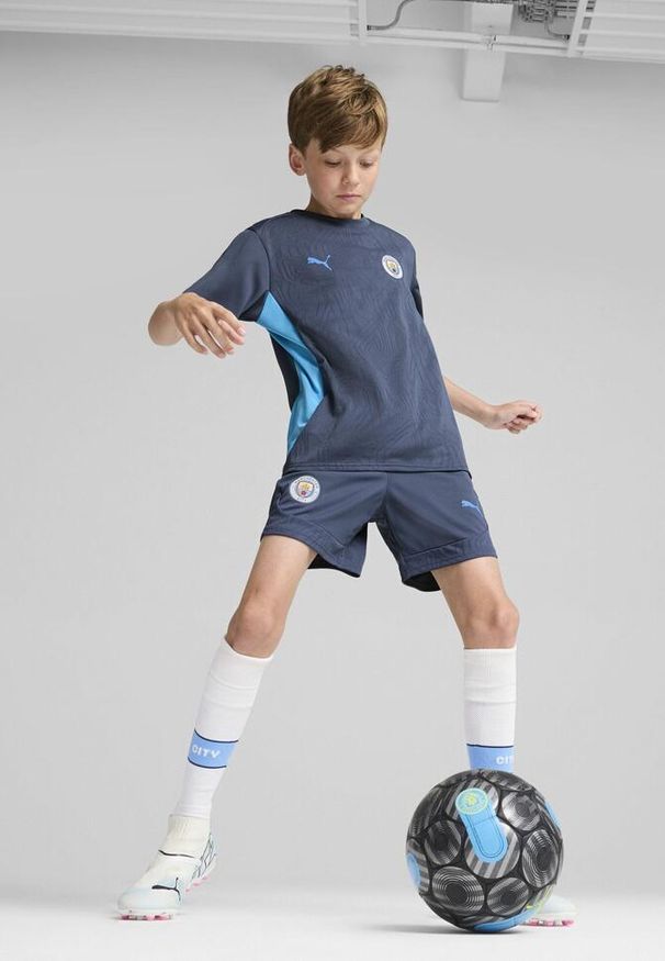 Puma - Młodzieżowe szorty treningowe Manchester City PUMA Inky Blue Magic. Kolor: niebieski