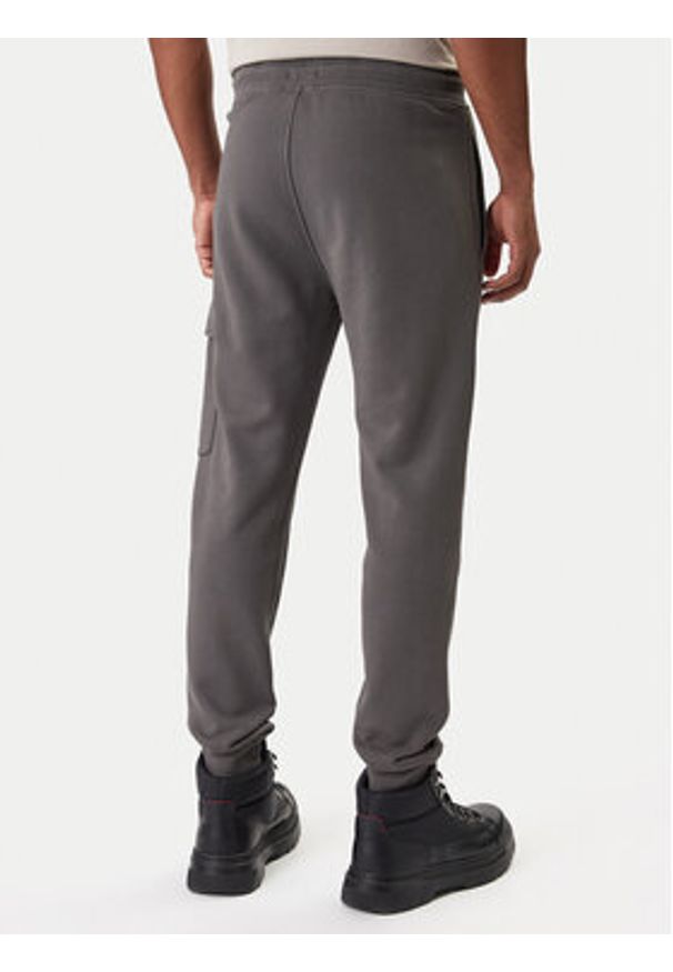 C.P. Company Spodnie dresowe 20CMSP067A110044R Szary Slim Fit. Kolor: szary. Materiał: bawełna