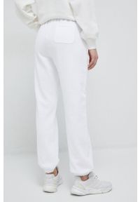 Champion spodnie dresowe kolor biały gładkie. Kolor: biały. Materiał: dresówka. Wzór: gładki #2