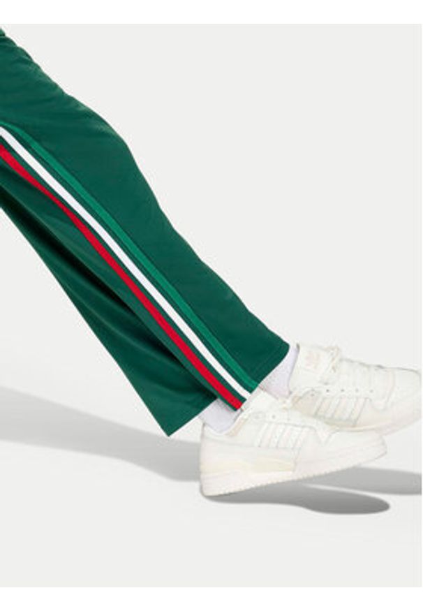 Adidas - adidas Spodnie dresowe Firebird KC9502 Zielony Regular Fit. Kolor: zielony. Materiał: syntetyk