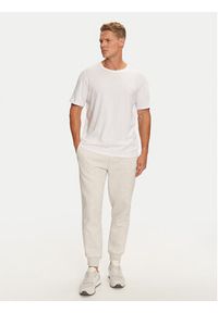 Calvin Klein Jeans Spodnie dresowe Monologo J30J325658 Szary Regular Fit. Kolor: szary. Materiał: syntetyk, bawełna