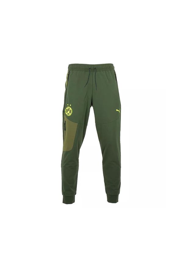 Puma - Spodnie dresowe Borussia Dortmund Tech Woven. Kolor: zielony. Materiał: dresówka. Sport: piłka nożna