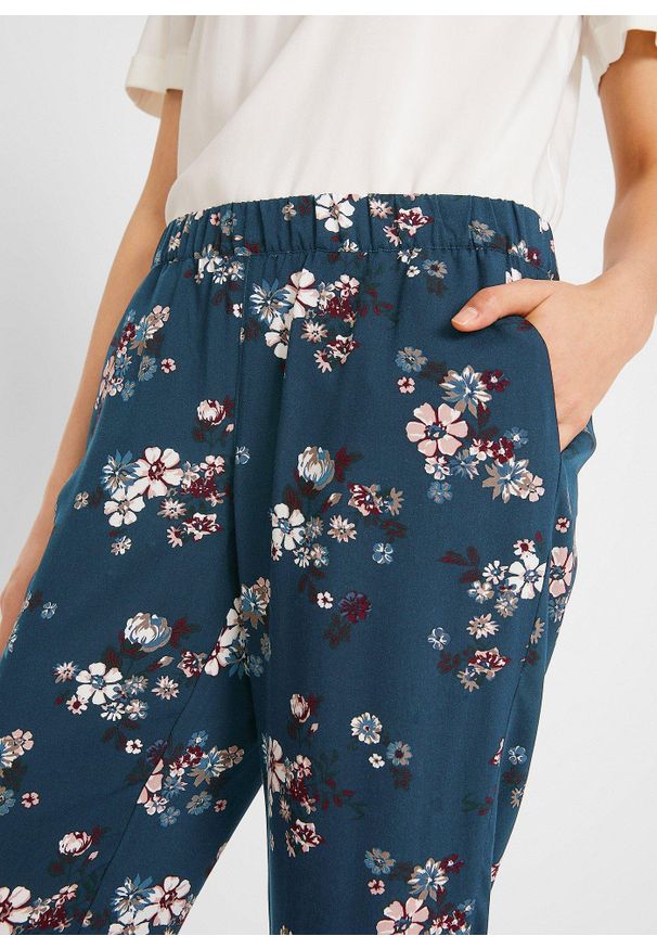 bonprix - Spodnie z gumką w talii, ze zrównoważonej wiskozy. Kolor: niebieski. Materiał: wiskoza. Wzór: nadruk