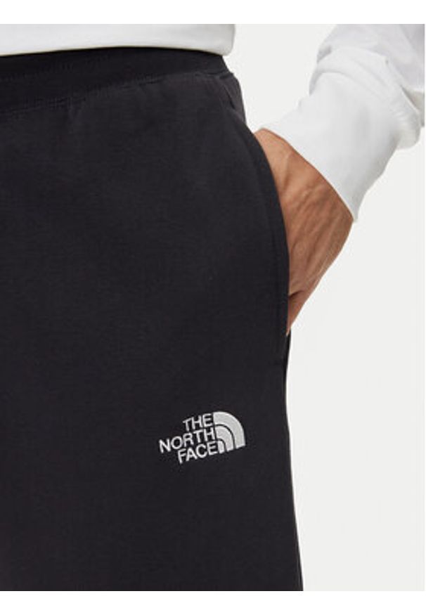 The North Face Spodnie dresowe Essential NF0A8C1F Czarny Relaxed Fit. Kolor: czarny. Materiał: syntetyk, bawełna