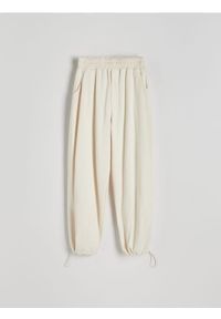 Reserved - Spodnie dresowe ze ściągaczami - złamana biel. Materiał: dresówka