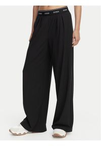 Guess Spodnie dresowe V6GB08 W1771 Czarny Relaxed Fit. Kolor: czarny. Materiał: syntetyk #1