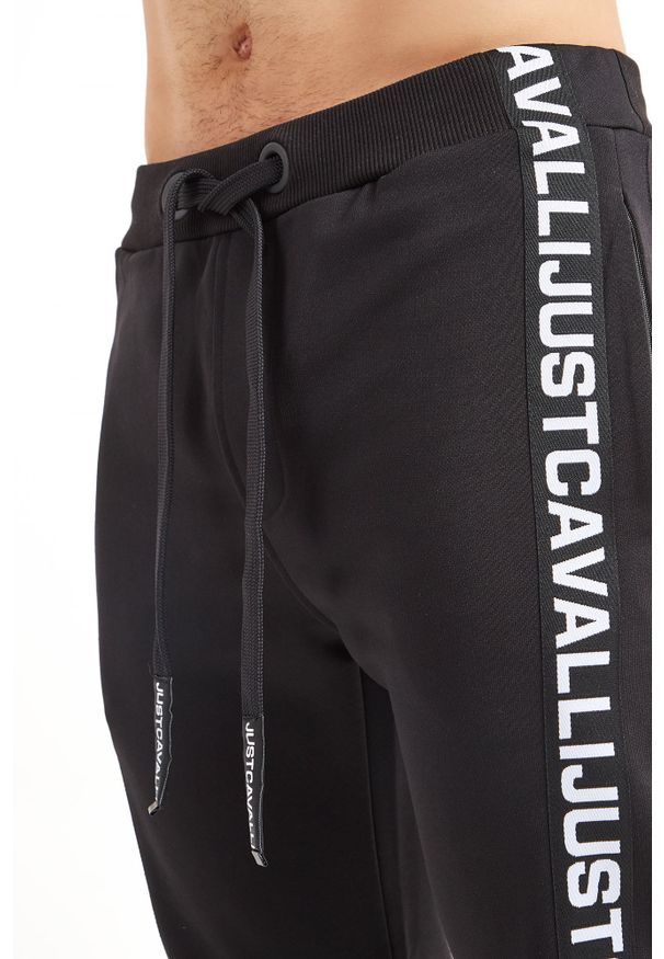 Just Cavalli - Spodnie dresowe JUST CAVALLI. Materiał: dresówka. Wzór: aplikacja, nadruk