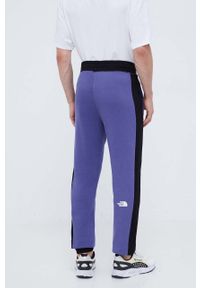 The North Face spodnie dresowe bawełniane kolor fioletowy wzorzyste. Kolor: fioletowy. Materiał: bawełna, dresówka #4