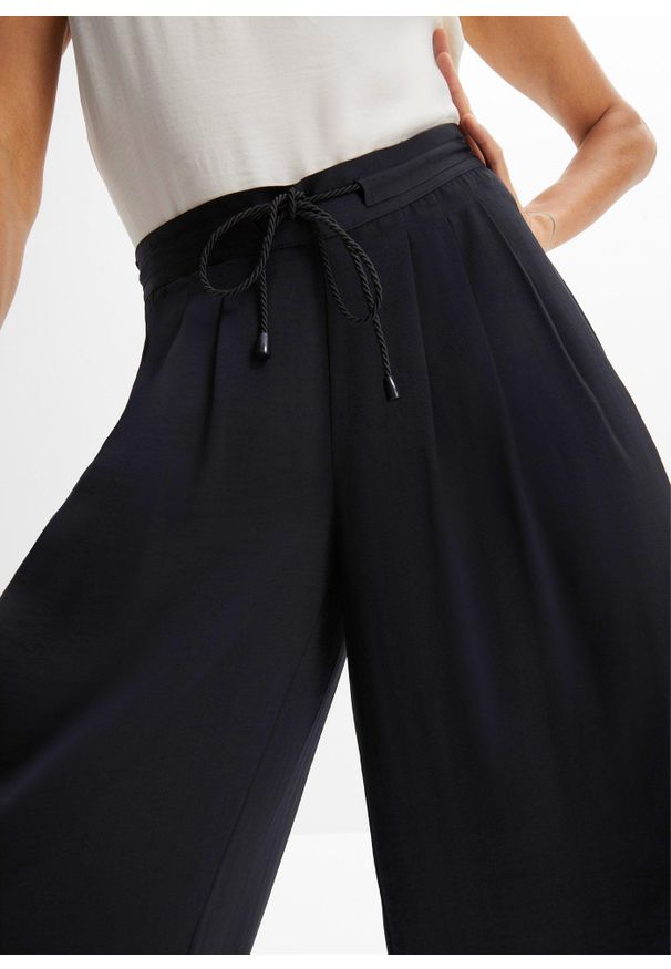 bonprix - Spodnie culotte z lejącej satyny. Kolor: czarny. Materiał: satyna