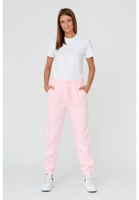 Juicy Couture - JUICY COUTURE Różowe damskie spodnie Sora, Rozmiar M. Kolor: różowy. Materiał: guma, bawełna