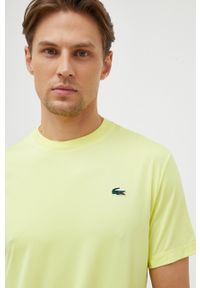 Lacoste t-shirt męski kolor zielony gładki. Kolor: żółty. Długość rękawa: krótki rękaw. Długość: krótkie. Wzór: gładki. Styl: klasyczny