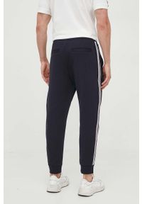 Armani Exchange spodnie dresowe kolor granatowy z aplikacją. Kolor: niebieski. Materiał: dresówka. Wzór: aplikacja #2