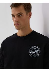 Reserved - Bawełniana bluza SUPERMAN™ - czarny. Kolor: czarny. Materiał: bawełna. Wzór: motyw z bajki