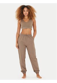 Athlecia Spodnie dresowe Hero W Track EA233336 Brązowy Regular Fit. Kolor: brązowy. Materiał: syntetyk