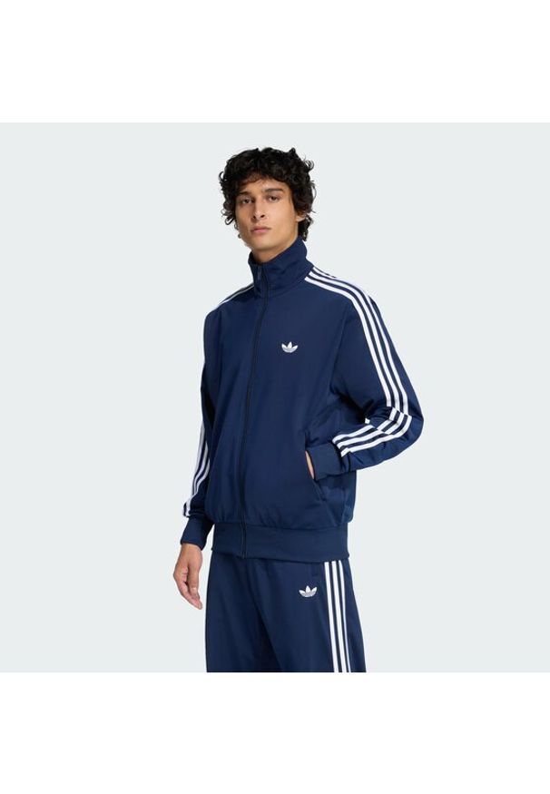 Adidas - adidas Bluza Firebird KD8313 Granatowy Loose Fit. Kolor: niebieski. Materiał: syntetyk