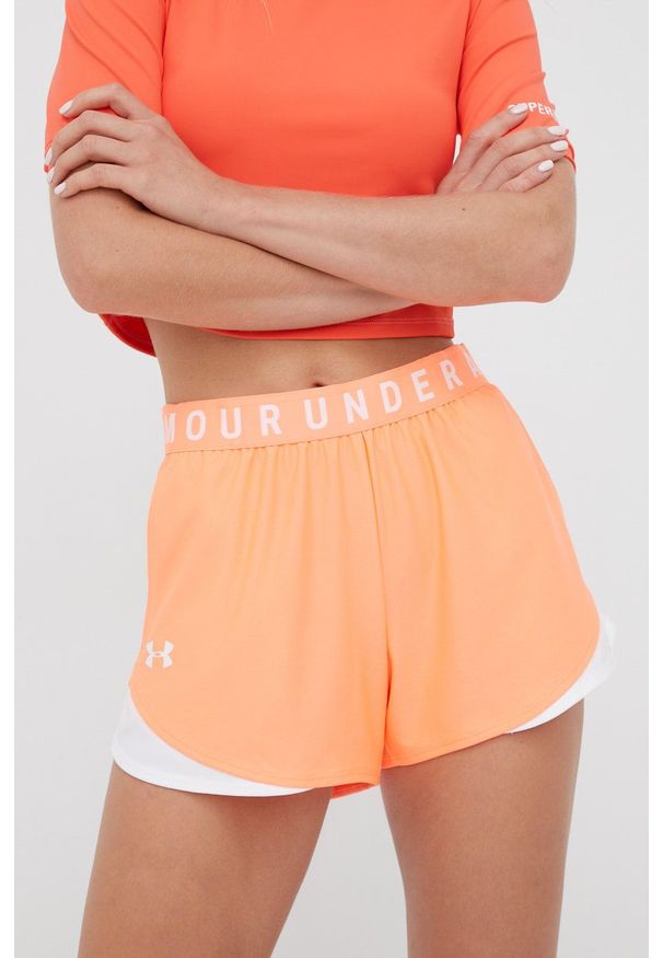 Under Armour Szorty 1344552 damskie kolor pomarańczowy z aplikacją medium waist. Okazja: na co dzień. Kolor: pomarańczowy. Wzór: aplikacja. Styl: casual