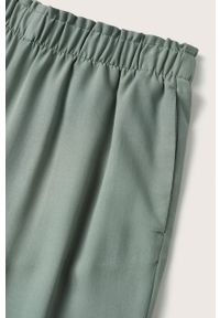 mango - Mango spodnie Fluido damskie kolor brązowy szerokie high waist. Stan: podwyższony. Kolor: brązowy. Materiał: włókno #9