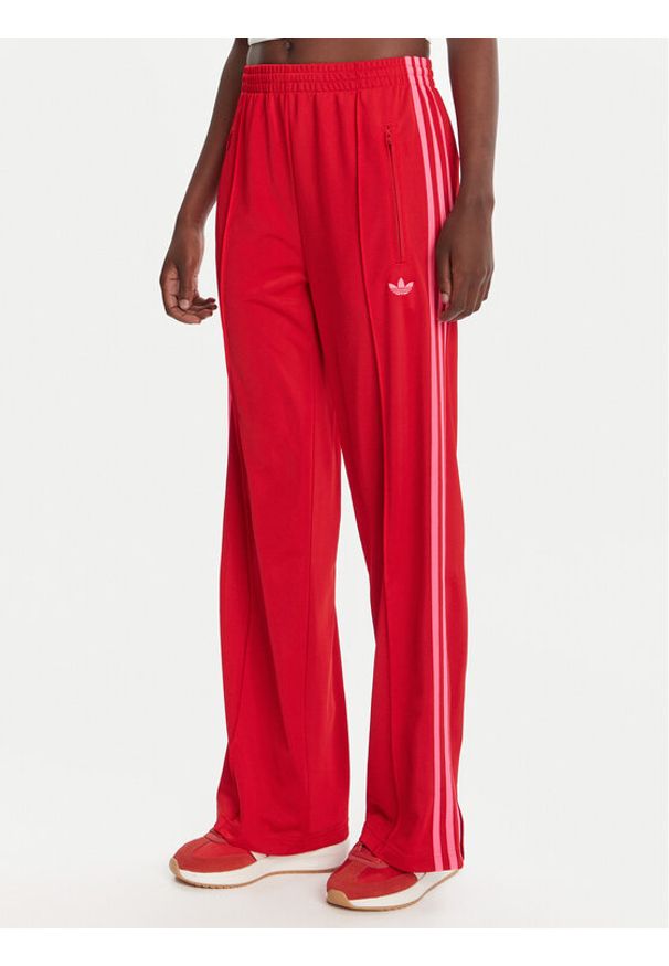 Adidas - adidas Spodnie dresowe adicolor Classic Firebird JW1225 Czerwony Loose Fit. Kolor: czerwony. Materiał: syntetyk