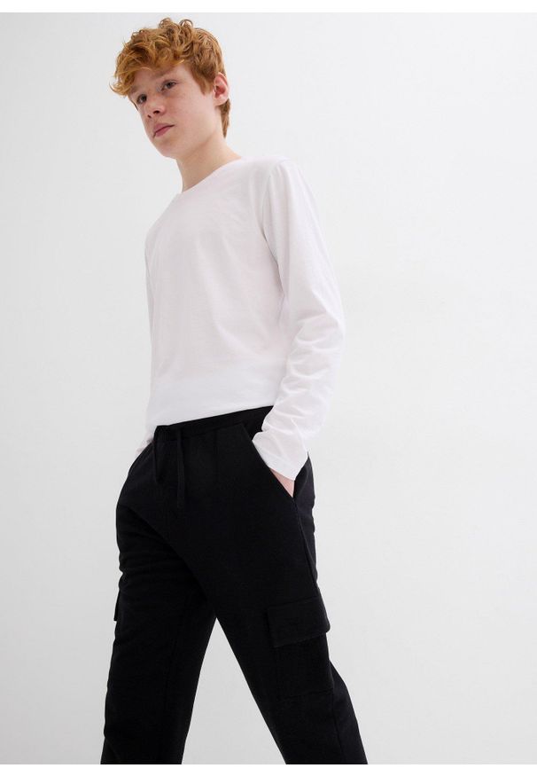 bonprix - Spodnie dresowe z kieszeniami cargo. Kolor: czarny. Materiał: dresówka