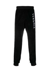 VERSACE - Czarne spodnie dresowe z logowanymi lampasami. Kolor: czarny. Materiał: dresówka #1