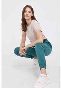 GAP Spodnie damskie kolor zielony gładkie. Kolor: zielony. Materiał: dzianina. Wzór: gładki