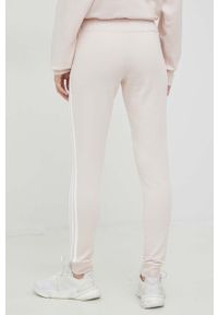 Adidas - adidas spodnie dresowe kolor różowy z aplikacją. Kolor: różowy. Materiał: dresówka. Wzór: aplikacja #2