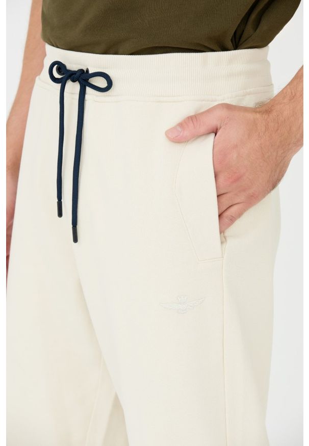 Aeronautica Militare - AERONAUTICA MILITARE Beżowe męskie spodnie, Rozmiar L. Kolor: beżowy. Materiał: dresówka