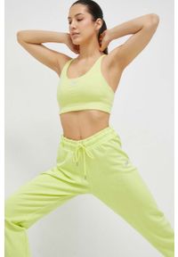 DKNY - Dkny biustonosz sportowy kolor żółty. Kolor: żółty. Materiał: materiał. Wzór: aplikacja #1