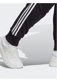 Adidas - adidas Spodnie dresowe Essentials 3-Stripes French Terry Cuffed Joggers (Plus Size) IB8745 Czarny Slim Fit. Kolekcja: plus size. Kolor: czarny. Materiał: bawełna #3