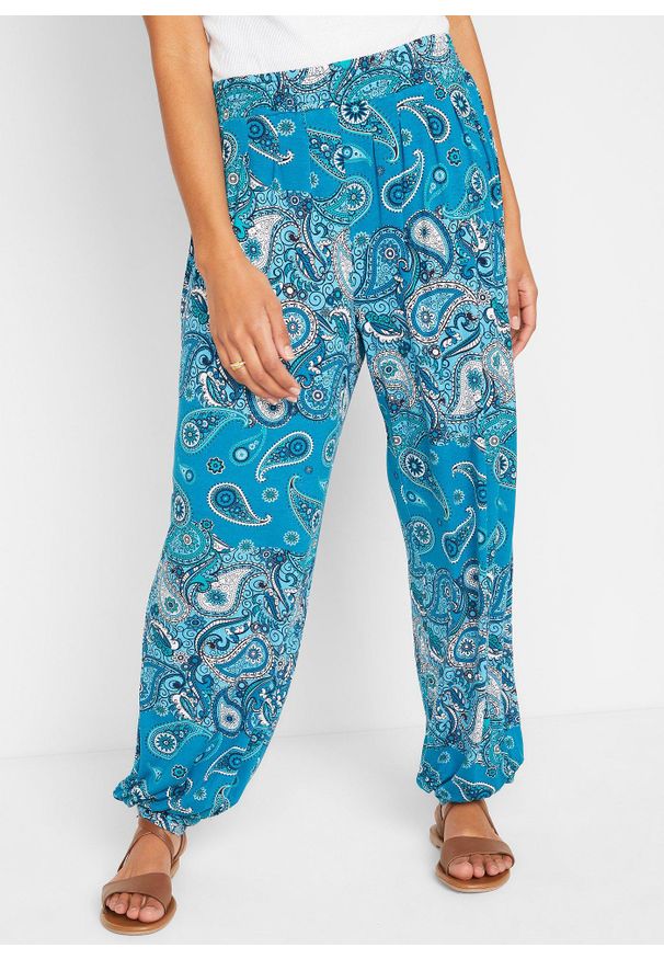 bonprix - Dżersejowe spodnie haremki z lejącej mieszanki wiskozy. Kolor: niebieski. Materiał: jersey, wiskoza. Wzór: nadruk, paisley