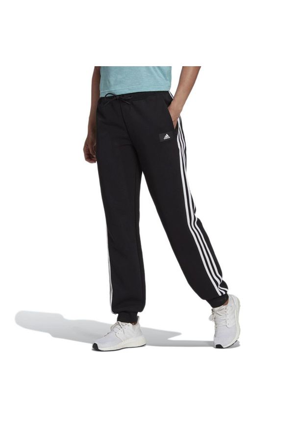 Adidas - Spodnie adidas Sportswear Future Icons 3-Stripes Regular Fit H57311 - czarne. Kolor: czarny. Materiał: bawełna, poliester, dresówka, materiał. Sport: turystyka piesza, fitness