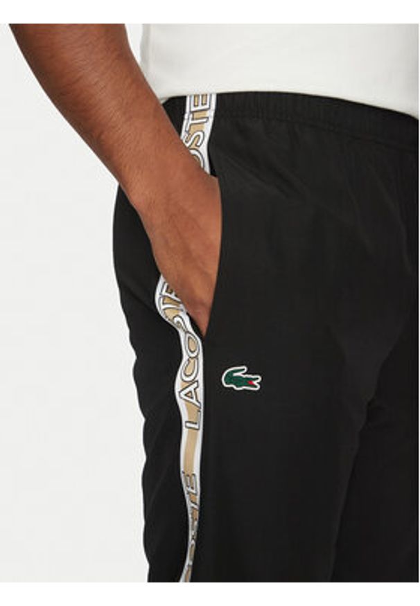 Lacoste Spodnie dresowe XH8974 Czarny Relaxed Fit. Kolor: czarny. Materiał: syntetyk