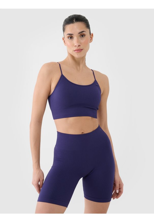 4f - 4F Biustonosz treningowy bezszwowy z niskim wsparciem damski - granatowy M/L. Kolor: niebieski. Materiał: dzianina, elastan, włókno, syntetyk, materiał, prążkowany, guma. Rodzaj stanika: wyciągane miseczki. Wzór: jednolity, ze splotem. Sport: fitness, joga i pilates