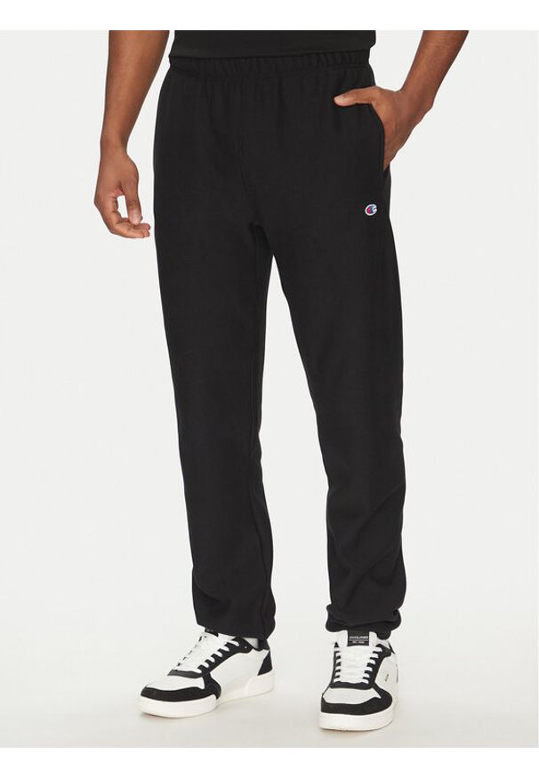 Champion Spodnie dresowe 221620 Czarny Regular Fit. Kolor: czarny. Materiał: bawełna