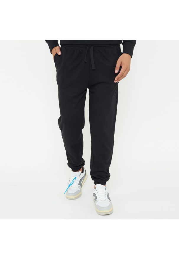 LEGEA - Spodnie sportowe Unisex F BALLON czarne. Kolor: czarny. Materiał: guma. Sport: fitness