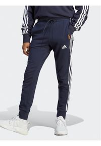 Adidas - adidas Spodnie dresowe Essentials French Terry Tapered Cuff 3-Stripes Joggers IC9406 Niebieski Regular Fit. Kolor: niebieski. Materiał: bawełna #1